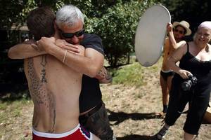 Gay Porn Directors - Porn star Christian Wilde, left hugs producer Tim Valenti, between shots  with Director Mr