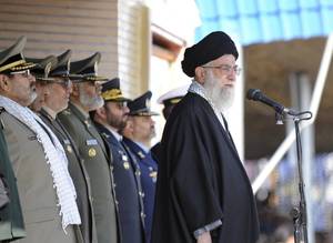 Iran Shore Porn - The Iranian leader Ayatollah Ali Khamenei, right, stands at the podium in  front of