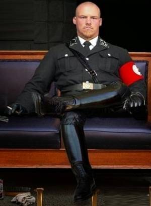 German Uniformes - Nazi SS officer in his full masterful uniform and tall black leather boots