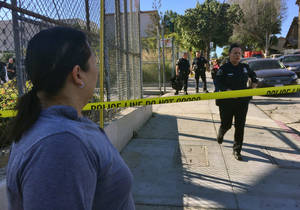 Middle School Girls Giving Blowjobs - Gloria Echeverria watches as Los Angeles police officers close off a street  where a shooting occurred at a middle school in Los Angeles on Thursday,  Feb.