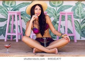 fat nude beach girl straw hat - Summer fashion image of young woman in sexy beach bikini with tasty  cocktail sitting on wood