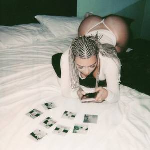 Charles Okeke Alexander Sex Tape - The 37 year old reality star flashed her bare breasts in new polaroid shots  .She also struck provocative poses with her famous derriere on display .
