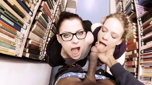 girls that suck black cock - Two Sexy White Girls Suck A Huge Black Cock In The Library Video at Porn Lib