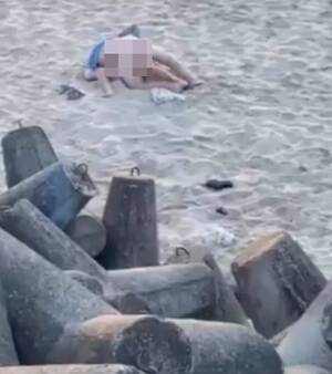 couples beach nude - Randy couple romp on beach before bather smacks flip flop on man's bottom |  The Sun