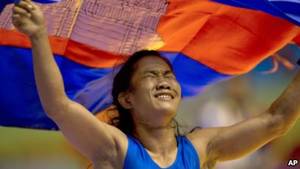 asian athlete - Cambodia's Chov Sotheara celebrates her victory over Thailand's Suree Porn  Pimpak to win the gold medal