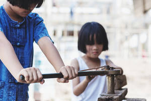 Forbidden Junior Porn - Children working at construction site for world day against children labour  concept: