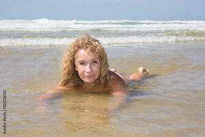 beach beauty contest naked - Beautiful blond european girl lying on sandy beach nude Stock Photo | Adobe  Stock