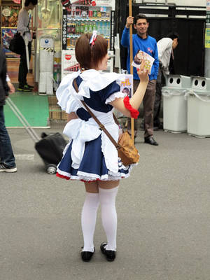 lil girl upskirt - Maid Advertising a Maid Cafe in Akihabara, Tokyo