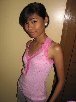 mature asian skinny - Slim 18 year old Asian girl shows her hairless pussy after a striptease -  NakedPics