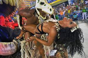 Brazilian Carnival Sex Videos - Rio Carnival heats up with floats celebrating gun-toting favela gangsters,  Victoria's Secret models and wild 'sex dancing' in skimpy outfits | The Sun
