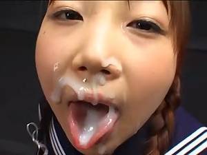japanese girls cum facials - Smiling Japanese girls kiss and swap cum while getting facials