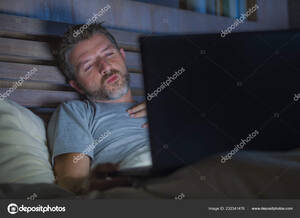 cyber sex movie - Young Aroused Man Alone Bed Playing Cybersex Using Laptop Computer Stock  Photo by Â©TheVisualsYouNeed 232341476