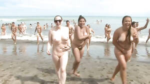 group nudist pool - Huge group of nudists swim in the ocean | voyeurstyle.com