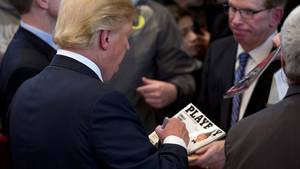 Girl In Cat Costume Porn - Donald Trump signs a copy of his cover of Playboy magazine.