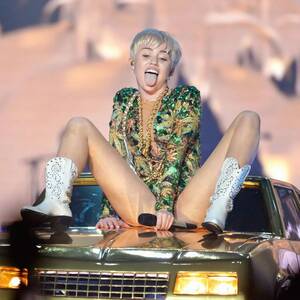 Miley And Selena Sexy - Miley Cyrus' Bangerz tour in pictures: Soft porn or artistic genius? -  Irish Mirror Online