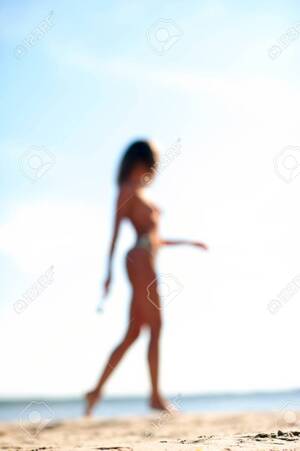 model walking on beach naked - Beautiful Nude Sexual Woman Walking On The Beach. Slender Body Defocused  Silhouette On Sunset Background. Summertime Vibrant Vertical Image. Stock  Photo, Picture and Royalty Free Image. Image 45991409.