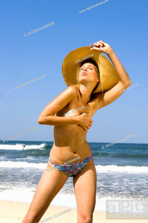 beach girls naked webcam - Semi-nude woman covering breasts at beach, Stock Photo, Picture And Rights  Managed Image. Pic. EXA-JA3-0134 | agefotostock