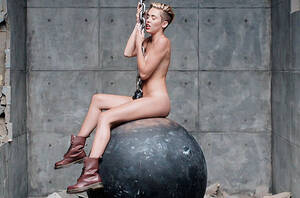 Miley Cyrus Tits Porn - Miley Cyrus Strips, Swings Around Naked in 'Wrecking Ball' Video: Watch