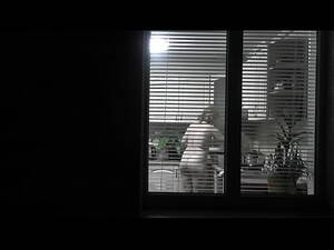 interracial voyeur window - Peeping. Voyeur. Neighbor pervert voyeur in evening on street looks out  window as naked sexy neighbor in kitchen prepares dinner for her husband.  Naked in public. Naked at home. Family. Outdoor -