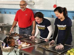 Asian Lesbian School Porn - Chef Michael Feker and two volunteers from Northwestern Mutual serve  students a hot breakfast.
