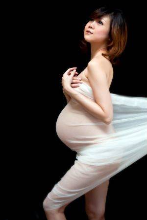 artistic nude prego - are flaunting their swollen bellies in artistic nude maternity shots .
