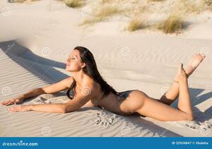 hot naked tanned beach babes - Nude Woman Sunbathing on the Beach Stock Image - Image of figure, naked:  32934847