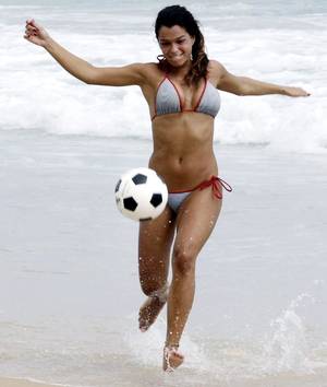 brazilian beach body sex - A woman plays soccer on Ipanema beach in Rio de Janeiro