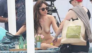 nude beach dakota - Dakota Johnson