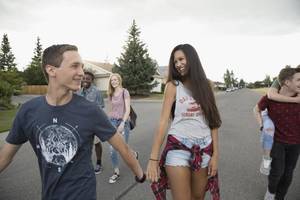 no more games for teen couple - Teenage couples walking on street