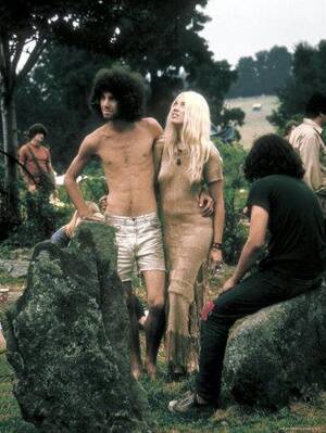 hippie nudist couples nude - Hippie Couple Posed Together Arm in Arm with Others Around Them, During  Woodstock Music/Art Fair' Photographic Print - John Dominis | Art.com