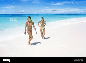 friends on the beach nude - Two young women nude on a topless beach in the Seychelle Islands Stock  Photo - Alamy