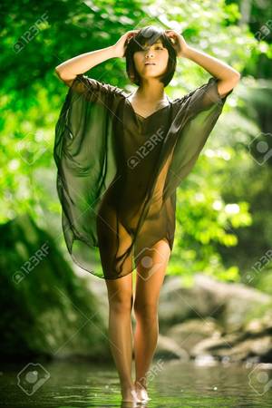 naked asian forest - Beautiful Asian woman naked under sheer robe, green jungle background Stock  Photo - 7157513