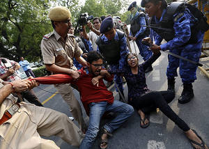 Delhi Porn - Police try to stop protestors during a demonstration against sexual  violence in Delhi