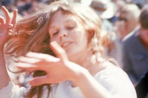 Hippies Summer Of Love Sex - A woman dances in the sun at the Magic Mountain Music Festival