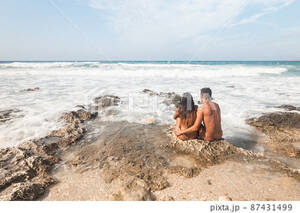 couples beach nude - Naked couple sitting on rocky seashore in summer - Stock Photo [87431499] -  PIXTA
