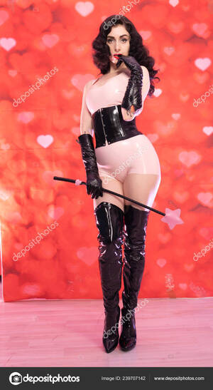 brunette in latex riding crop - Pinup Brunette Woman Wearing Pink Latex Rubber Costume Black Fetish Stock  Photo by Â©agnadevi 239707142