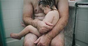 free nudist pics - What does this father-son image say about our attitude towards nudity?