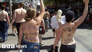 forced strip big boobs - Does the US have a problem with topless women?