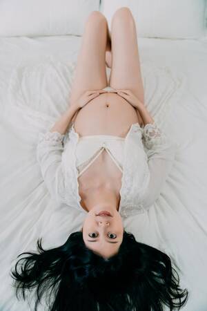 beautiful asian face down nudes - Premium Photo | Upside down view of happy young pregnant asian korean woman  lying in bed face camera. smiling future mother in sexy lingerie with gown  hold naked belly and feel baby