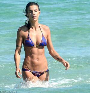 Elisabetta Canalis - Elisabetta Canalis shows off her washboard abs as she emerges from the sea  | Daily Mail Online