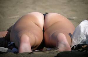fat ass milf beach - Big ass MILF catching some sun at the beach
