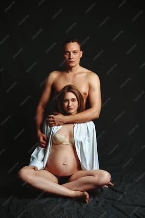 couples nudism up close - Premium Photo | A pregnant couple posing at the camera on a dark space, low  key. fashion pregnancy concept. copy space, black space.