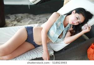 japan no nude girls - sexy beautiful asian japanese model young lady Pin Up girl posing lying on  lounge chair wearing
