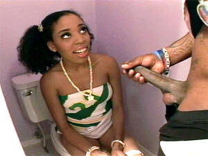 ebony teen suck black - Young ebony girl sucking cock sitting on the toilet.