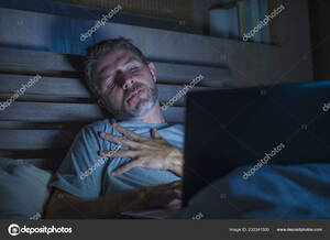 cyber sex movie - Young Aroused Man Alone Bed Playing Cybersex Using Laptop Computer Stock  Photo by Â©TheVisualsYouNeed 232341500