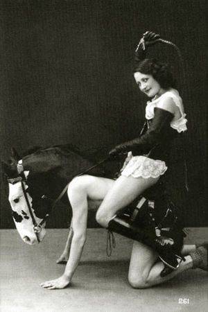 1920s Vintage Slave Porn - Biederer Studio - A dominatrix rides a male pony-slave in an elaborate  training costume (c.