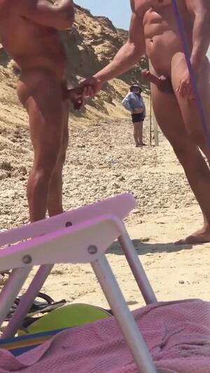 cfnm beach stroke - Guys stroking eachother at public beach - ThisVid.com