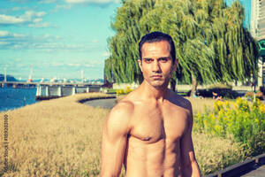 east indian american nude - Young East Indian American Man, half naked, showing strong body, standing  at park in New York under sun, serious, looking forward, . Photos | Adobe  Stock