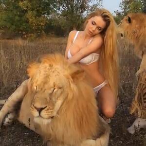 Lion Porno - Porn star Katya Sambuca poses semi naked straddling two LIONS that were  snarling and snapping in discomfort sparking animal rights outrage | The Sun