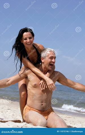 adult naturist beach videos - Couple Having Fun on the Beach Stock Photo - Image of aged, adults: 11075746